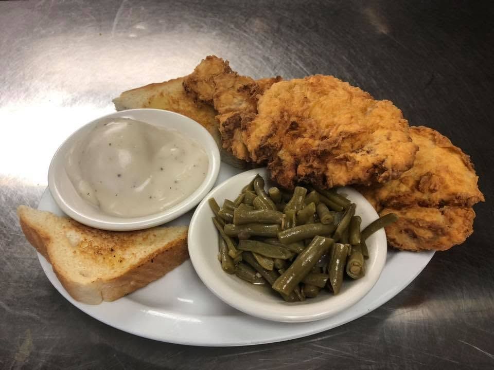 Chicken-fried steak with cream gravy, green beans, and Texas toast